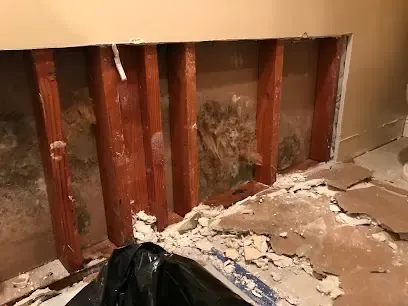 A burst copper pipe spraying water in a Santee, CA home